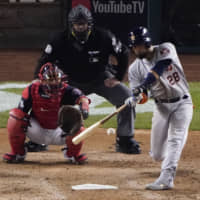Houston's Robinson Chirinos hits a home run against Washington in the sixth inning of Game 3 of the World Series on Friday night.