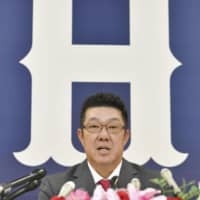 Shinji Sasaoka, the new manager of the Hiroshima Carp, speaks at a news conference on Monday in Hiroshima.
