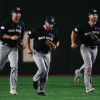 Australia's players celebrate after their Premier12 Super Round win over the United States on Wednesday at Tokyo Dome.
