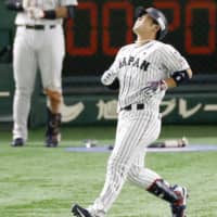 Samurai Japan outfield Kensuke Kondo reacts after flying out to end the seventh inning against the United States on Tuesday at Tokyo Dome.