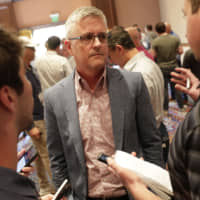 Astros general manager Jeff Luhnow speaks to reporters during MLB's annual general managers meeting on Tuesday in Scottsdale, Arizona.