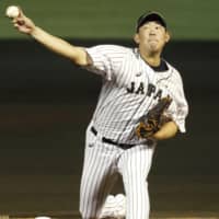 Japan starter Shun Yamaguchi pitches against Canada in an exhibition game on Thursday in Naha, Okinawa Pref. Canada beat Japan 6-5.