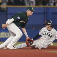 Samurai Japan pinch runner Ukyo Shuto steals second base in the seventh inning on Monday against Australia in a Premier12 game at Zozo Marine Stadium.