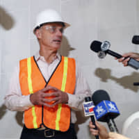 Baseball Commissioner Rob Manfred speaks to the media during a tour of the new Texas Rangers stadium currently under construction in Arlington, Texas, on Tuesday.