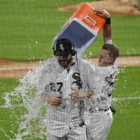 White Sox pitcher Lucas Giolito is doused with water after throwing a no-hitter against the Pirates on Tuesday in Chicago. | USA TODAY / VIA REUTERS