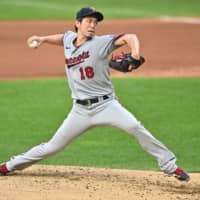 Twins starting pitcher Kenta Maeda throws against the Indians on Monday in Cleveland. | USA TODAY / VIA REUTERS
