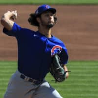 Cubs starter Yu Darvish pitches against the Reds on Saturday in Cincinnati. | AP
