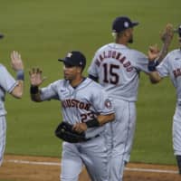 The Astros celebrate a win over the Dodgers on Saturday in Los Angeles. | AP