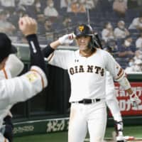 The Giants' Hayato Sakamoto celebrates after his home run against the Swallows in the eighth inning Friday. | KYODO