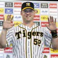 The Tigers' Jerry Sands celebrates during his hero interview on Sept. 1 in Nishimoniya, Hyogo Prefecture. | KYODO