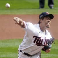 Twins starter Kenta Maeda pitches against the Astros in Game 1 of their American League wild-card series on Tuesday in Minneapolis. | AP