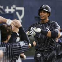 Steven Moya is congratulated by his teammates after hitting a home run for Orix on Sunday. | KYODO