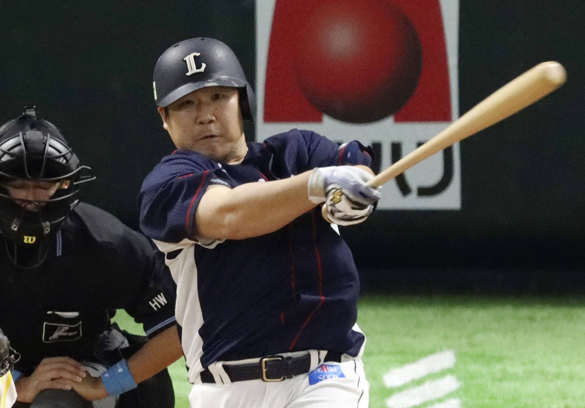 Lions slugger Takeya Nakamura connects on a grand slam against the Hawks on Saturday in Fukuoka. | KYODO