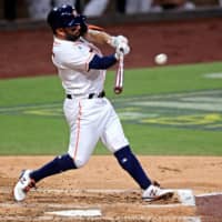 Astros second baseman Jose Altuve connects on a double against the Rays during the third inning in Game 4 of the ALCS on Wednesday in San Diego. | USA TODAY / VIA REUTERS