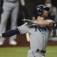 The Rays' Brandon Lowe homers against the Dodgers during the first inning in Game 2 of the World Series on Wednesday in Arlington, Texas. | AP