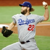 Dodgers starter Clayton Kershaw pitches against the Rays during Game 5 of the World Series in Arlington, Texas, on Sunday. | USA TODAY / VIA REUTERS