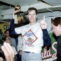 Dodgers pitcher Orel Hershiser holds his World Series Most Valuable Player trophy following the Dodgers' decisive 5-2 win over the Oakland Athletics to clinch the World Series on Oct. 20, 1988, in Oakland, California. | AP