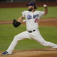 Dodgers starter Clayton Kershaw pitches against the Rays during Game 1 of the World Series in Arlington, Texas, on Tuesday. | AP