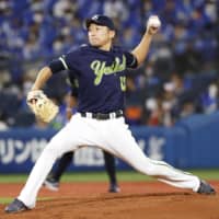 The Swallows' Masanori Ishikawa pitches against the BayStars at Yokohama Stadium on Sept. 30. | KYODO