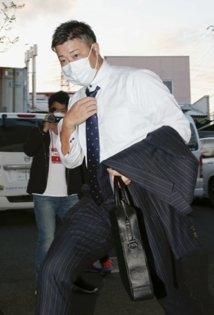 Junichi Tazawa arrives ahead of a planned news conference on Monday in Kumagaya, Saitama Prefecture. | KYODO