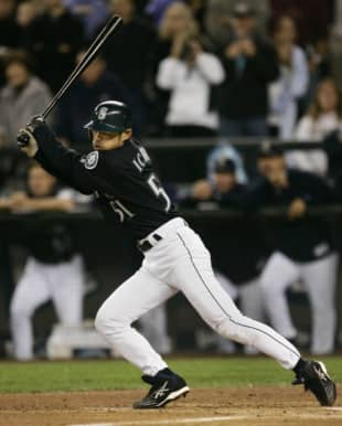 Seattle's Ichiro Suzuki of Japan hits a single against the Rangers for his 258th hit of the season, surpassing George Sisler's record, on Oct. 1, 2004, in Seattle. | REUTERS