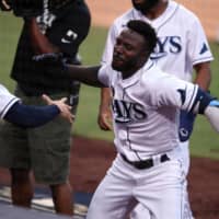 Rays left fielder Randy Arozarena (right) celebrates his two-run home run against the Astros on Saturday in San Diego. | USA TODAY / VIA REUTERS