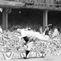 The Yankees' Whitey Ford pitches against the Pirates during a World Series game at Yankee Stadium in New York on Oct. 8, 1960. | AP
