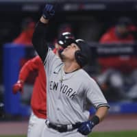 Gio Urshela celebrates after hitting a grand slam against the Indians during Game 2 of their American League wild-card series on Wednesday in Cleveland. | AP