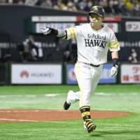 Hawks first baseman Akira Nakamura starts to round the bases after hitting a two-run home run during the third inning in Game 3 of the Japan Series at PayPay Dome in Fukuoka on Tuesday. | KYODO
