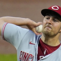 Reds pitcher Trevor Bauer delivers against the Pirates during the second game of a doubleheader in Pittsburgh on Sept. 4. | AP