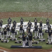 NC Dinos players celebrate after winning the 2020 Korean Series, the Korea Baseball Organization's championship round, against the Doosan Bears following Game 6 at Gocheok Sky Dome in Seoul on Tuesday. | AP