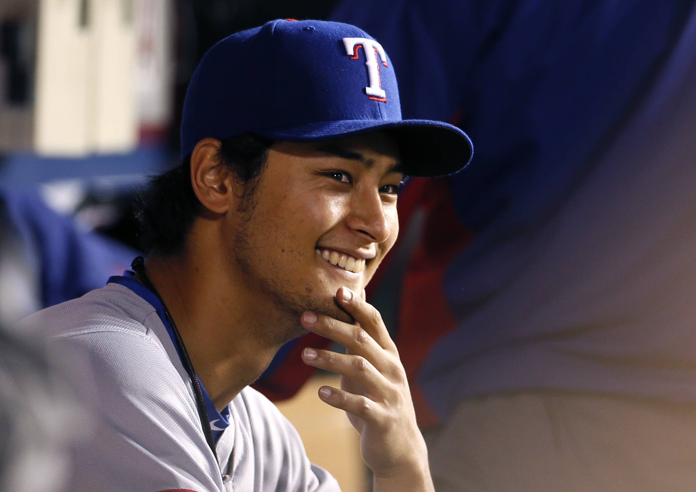 Rangers pitcher Yu Darvish of Japan smiles during a game against the Angels on April 24, 2013, in Anaheim, California. | REUTERS