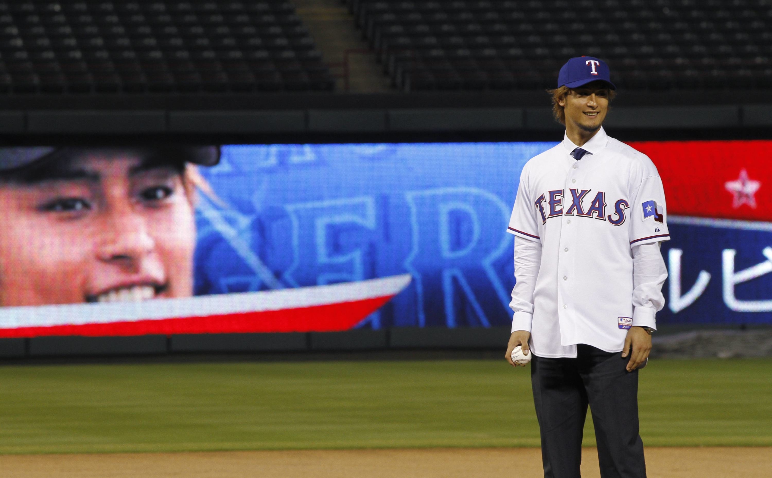 Yu Darvish takes the mound during his unveiling by the Rangers on Jan. 20, 2012, in Arlington, Texas. | REUTERS