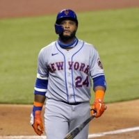 Robinson Cano walks back to the dugout during a game against the Marlins in Miami on Aug. 17. | AP