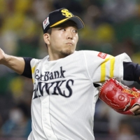 SoftBank's Kodai Senga pitches against the Marines during Game 1 of the Pacific League Climax Series in Fukuoka on Nov. 14. | KYODO