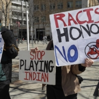 Cleveland's use of the Indians name as well as mascot Chief Wahoo has drawn regular protests over the years. The club removed Chief Wahoo from its caps and jerseys in 2019. | AP