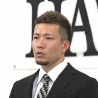 Hawks pitcher Kodai Senga speaks during a news conference at PayPay Dome on Saturday. | KYODO