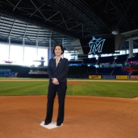 Kim Ng stands on home plate at Marlins Park during her unveiling as the team's new general manager on Nov. 16 in Miami. | HANDOUT / VIA USA TODAY / VIA REUTERS