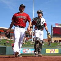 Diamondbacks pitcher Madison Bumgarner (left) leaves the bullpen with catcher Stephen Vogt to face the Reds in his Cactus League debut on Feb. 27 in Scottsdale, Arizona. | ARIZONA REPUBLIC / VIA USA TODAY / VIA REUTERS
