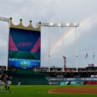  A partial rainbow appears past the scoreboard as the Indians warm up before the game against the Royals at Kauffman Stadium, in Kansas City. Missouri on July 25. | USA TODAY / VIA REUTERS