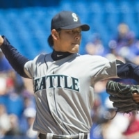 Now-former Mariners president Kevin Mather accused former pitcher Hisashi Iwakuma, now a special assignment coach with the club, of having poor English skills. | REUTERS