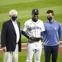 Mariners general manager Jerry Dipoto (right) says the team will have to redouble its comment to its players following the resignation of former CEO Kevin Mather (left) in the wake of controversial comments he made earlier this month. | USA TODAY / VIA REUTERS