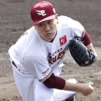 Eagles starter Masahiro Tanaka pitches against the Fighters during a practice game in Kin, Okinawa Prefecture, on Saturday. | KYODO