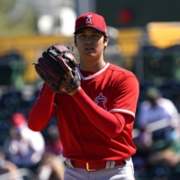 Angels starter Shohei Ohtani pitches against the A's during a spring training game in Mesa, Arizona, on Friday. | USA TODAY / VIA REUTERS