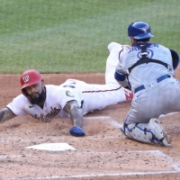 Nationals first baseman Eric Thames slides home ahead of a tag during a game against the Blue Jays in Washington on July 27, 2020. | USA TODAY / VIA REUTERS