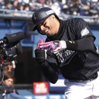 Marines outfielder Leonys Martin celebrates after hitting his second home run of the afternoon against the Lions at Zozo Marine Stadium on Saturday. | KYODO