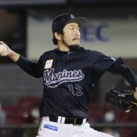 Lotte's Ayumu Ishikawa pitches against Rakuten on Thursday in Sendai. | KYODO