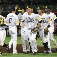 The Hawks celebrate after their win over the Buffaloes on Thursday in Fukuoka. | KYODO