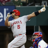 Angels first baseman Albert Pujols hits a home run against the Rangers during the fourth inning in Arlington, Texas, on April 26. | USA TODAY / VIA REUTERS