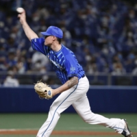 BayStars starter Michael Peoples pitches against the Dragons at Vantelin Dome Nagoya on Monday. | KYODO